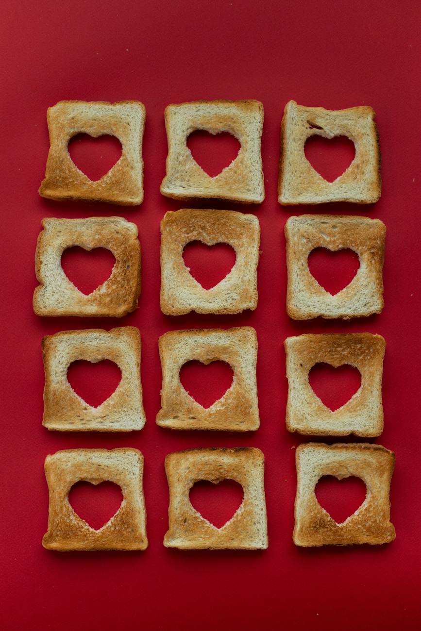 slices of toasted bread with cut out hearts